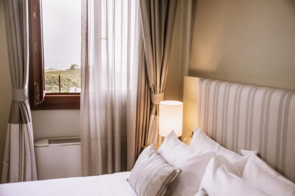 Postel nebo postele na pokoji v ubytování Boutique Hotel Municipio 1815
