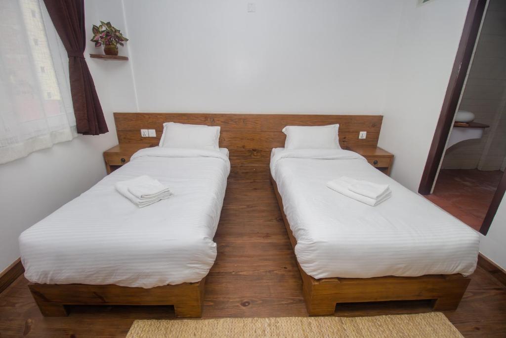 Postel nebo postele na pokoji v ubytování Yalamul Garden