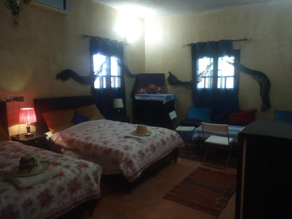 Postel nebo postele na pokoji v ubytování Maison Riad Tamarighte