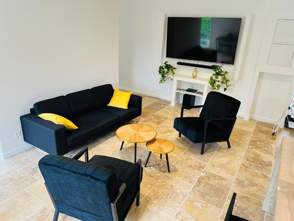 Televízia a/alebo spoločenská miestnosť v ubytovaní Feel@home Nemausus «Le 31»