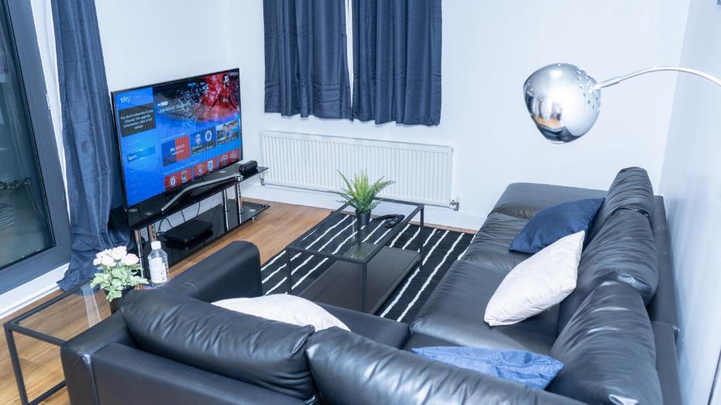 Zona de estar de Guerneville place 1 bedroom Luxury Apartment Gants-Hill in Illford