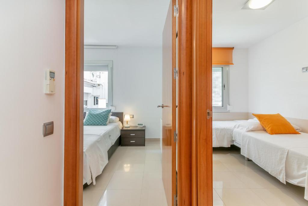 Postel nebo postele na pokoji v ubytování Fragata Sitges Rentals