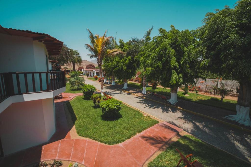 an overhead view of a courtyard with trees and grass at EL MANÁ in Huarmey