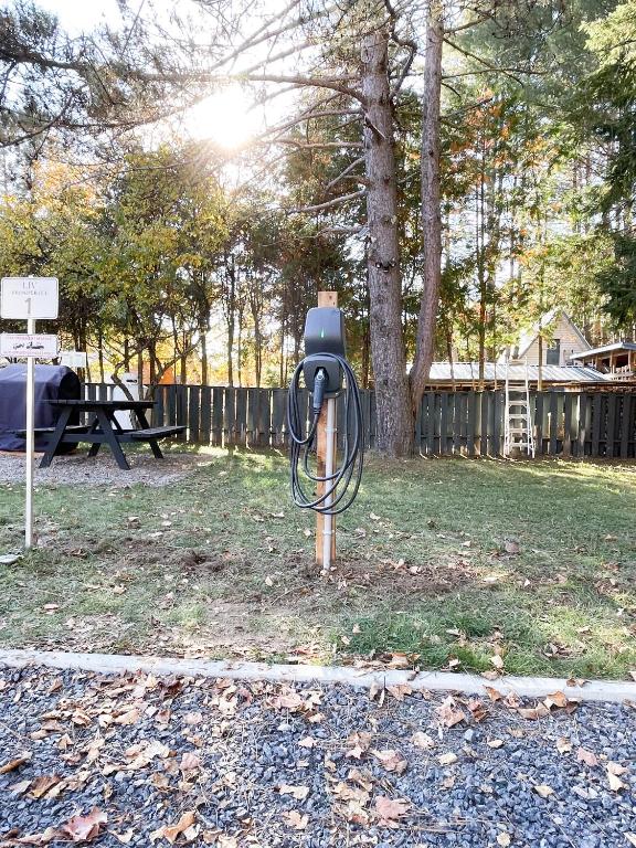 a parking meter sitting in the grass in a park at Complexe LIVTremblant by Gestion ELITE - LIV6 in Mont-Tremblant