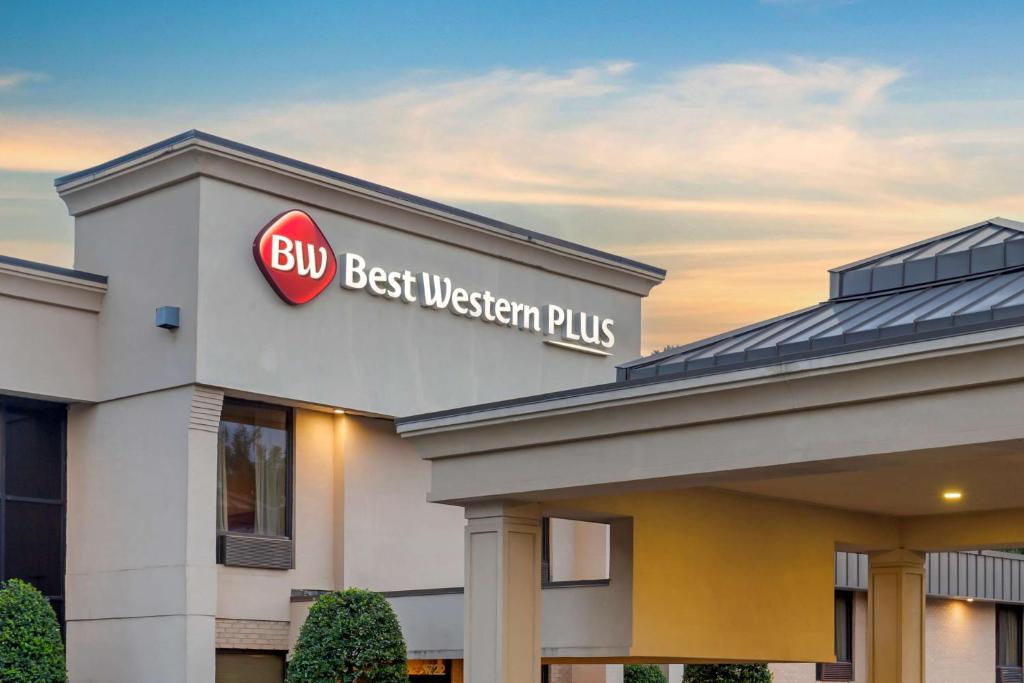 a building with a sign that reads buy best western plus at Best Western Plus Cary - NC State in Cary