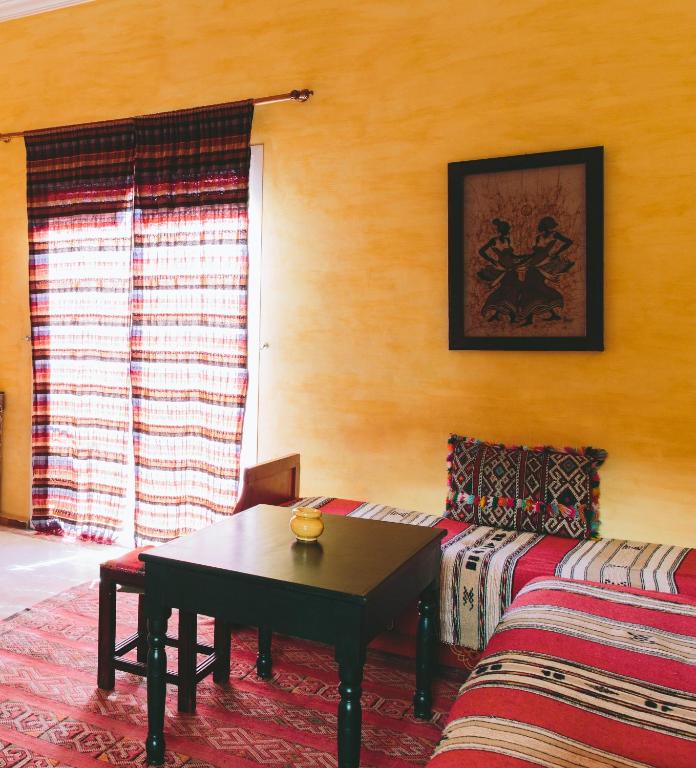 Postel nebo postele na pokoji v ubytování Riad Zahra