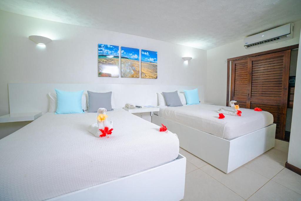 Postel nebo postele na pokoji v ubytování Paradise Beach Hotel & Resort