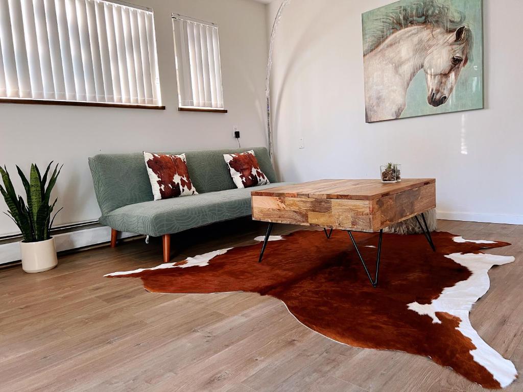 a living room with a couch and a coffee table at All-ways Home in Burnaby