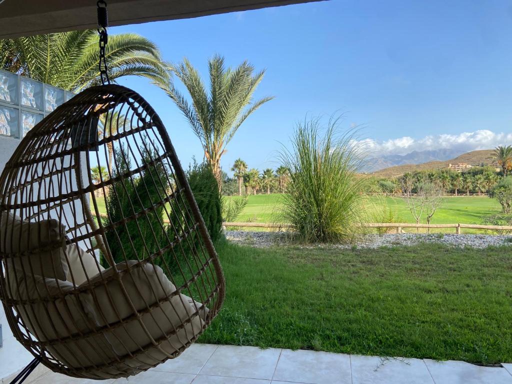 a hanging basket with a view of a yard at Destino Deluxe Valle del Este Vera in Vera