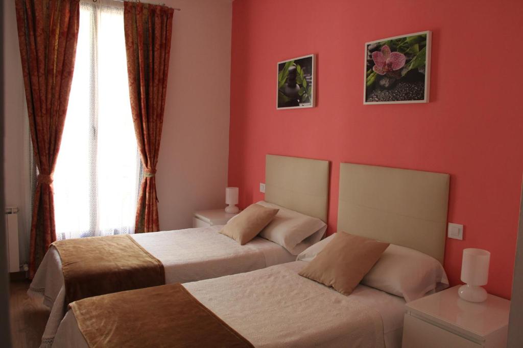Postel nebo postele na pokoji v ubytování Casa de Huéspedes Galaica