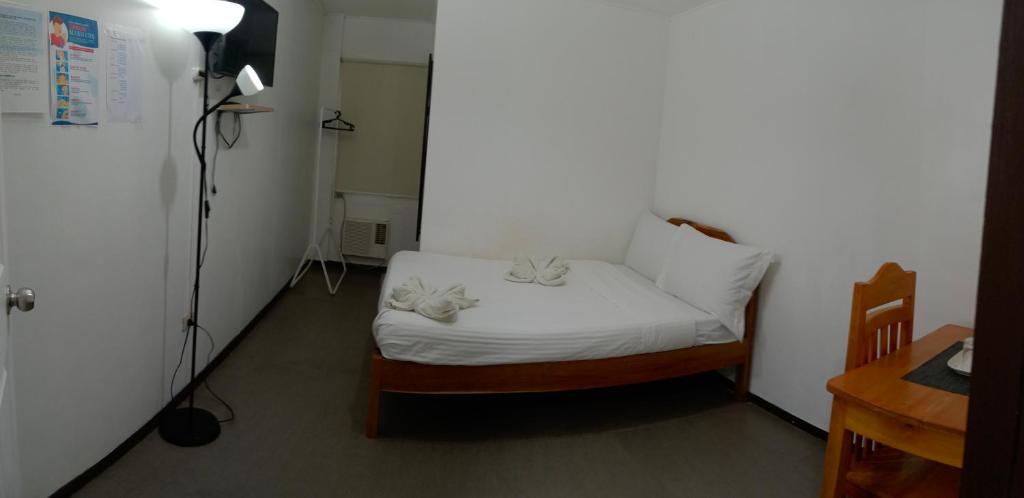 Postel nebo postele na pokoji v ubytování Amor's Place