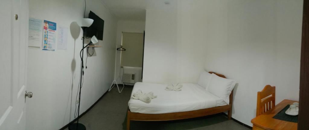 Postel nebo postele na pokoji v ubytování Amor's Place