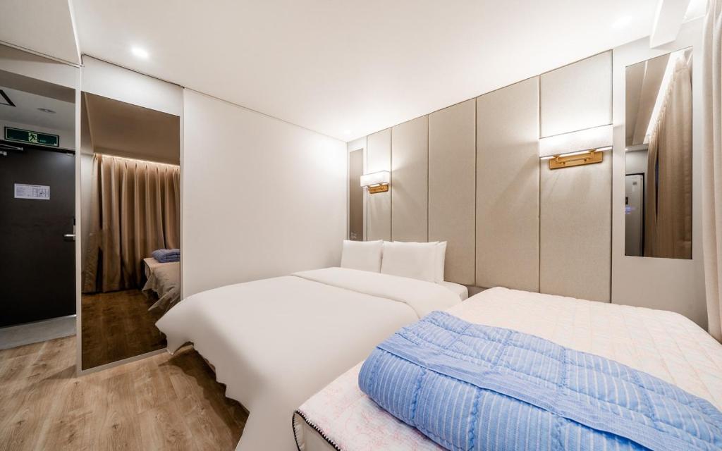 Postel nebo postele na pokoji v ubytování Ocean city hotel