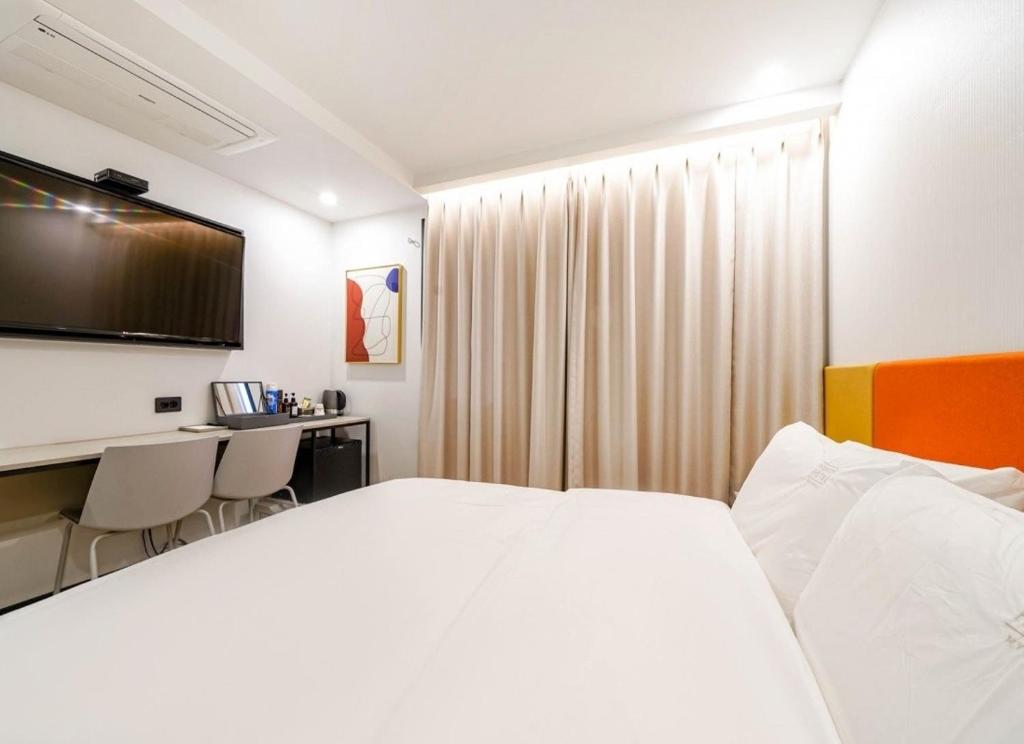 Postel nebo postele na pokoji v ubytování Ocean city hotel