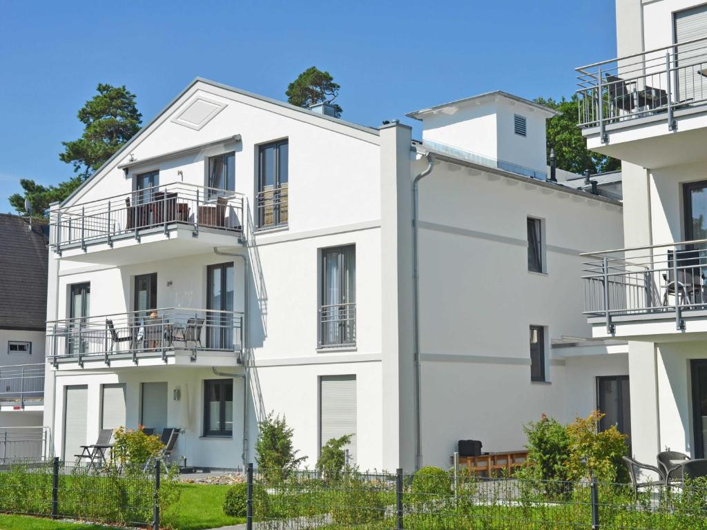 a white apartment building with balconies on it at Residenz Margarete - Penthouse 2.7 in Binz