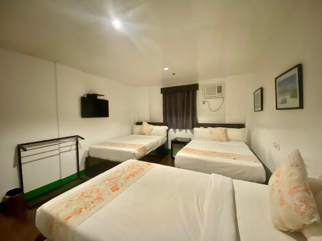 Postel nebo postele na pokoji v ubytování Emerald Bay Boracay