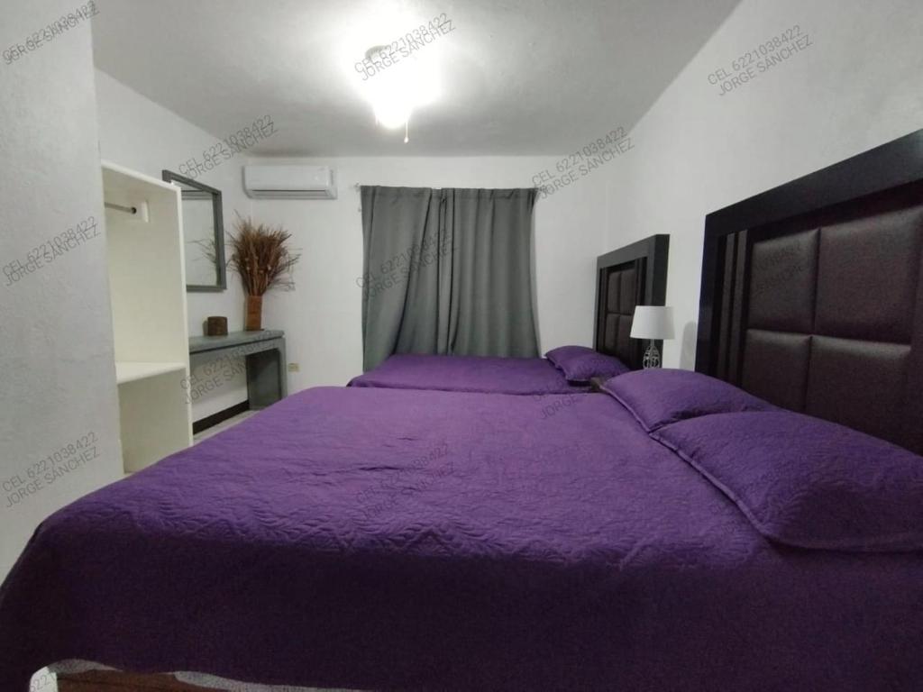 A bed or beds in a room at Condominio 303 Loma Bonita, enfrente de la alberca!