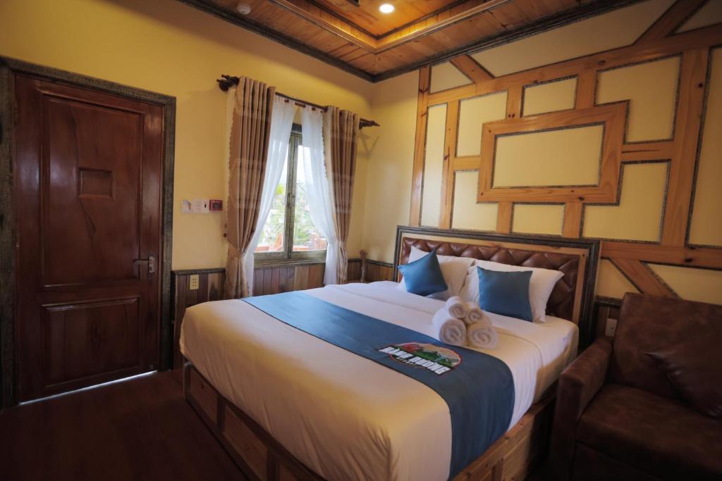 Voodi või voodid majutusasutuse Resort Hàng Dương toas