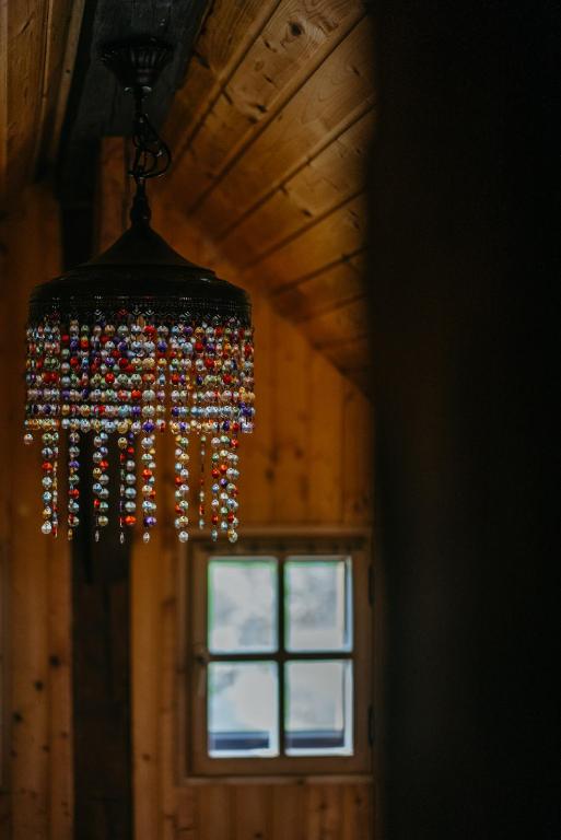 a chandelier hanging from a ceiling with a window at Kellerstöckl Berg 106 in Strem