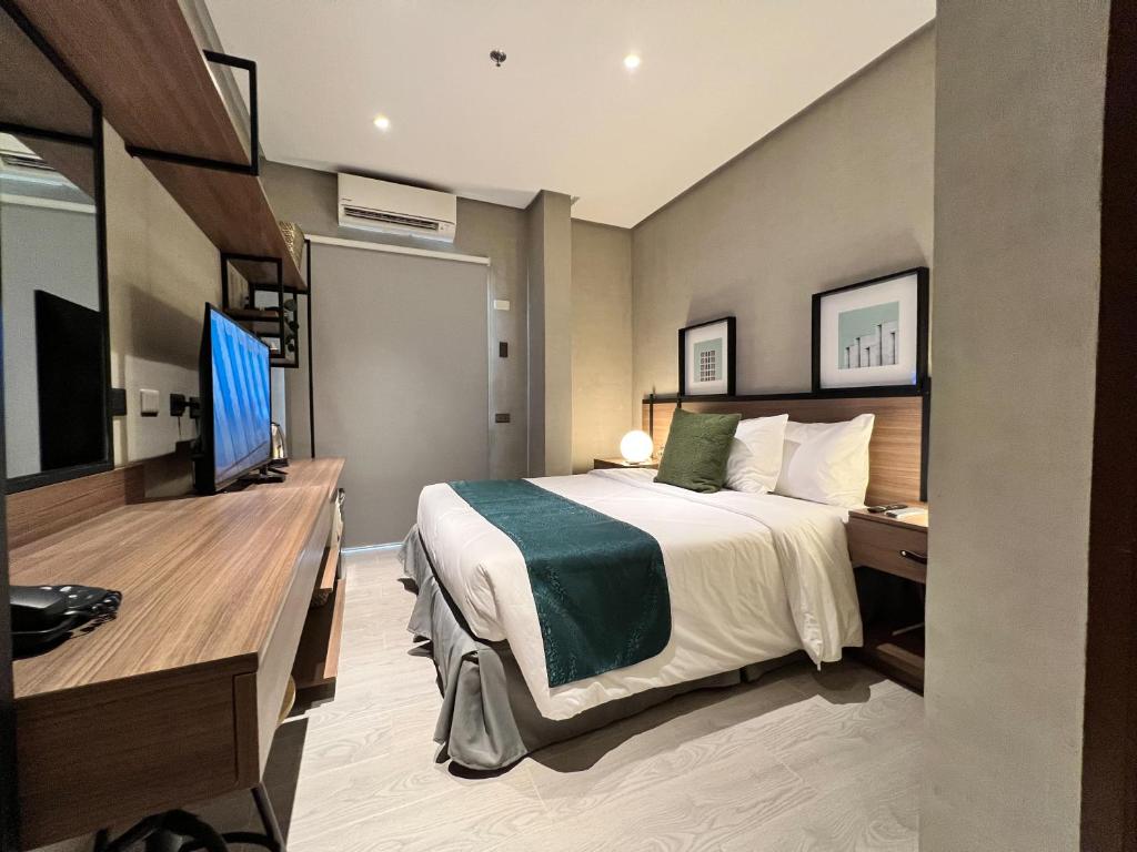 Postel nebo postele na pokoji v ubytování Acro Residences