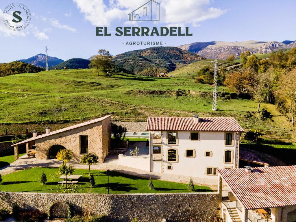 an image of a villa with a mountain in the background at EL SERRADELL AGROTURISME in Sant Joan de les Abadesses