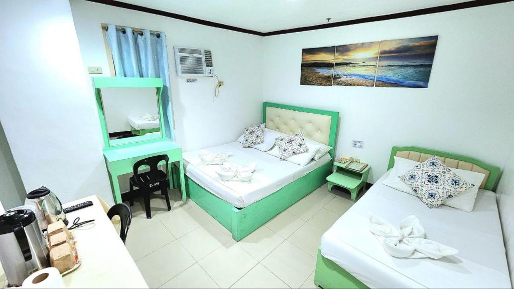 Postel nebo postele na pokoji v ubytování Demiren Hotel