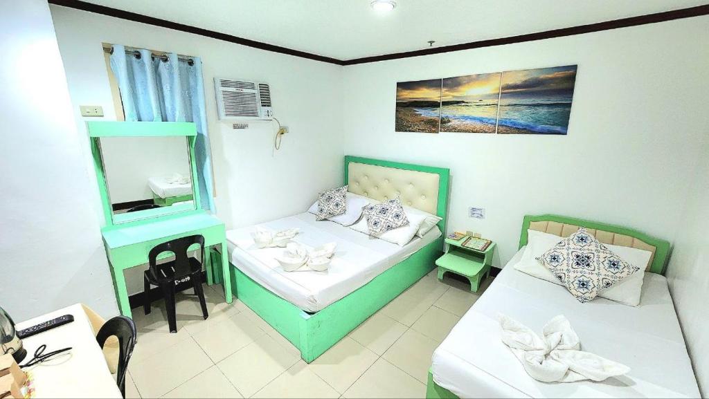 Postel nebo postele na pokoji v ubytování Demiren Hotel