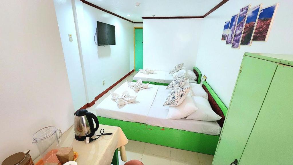 Postel nebo postele na pokoji v ubytování Demiren Hotel