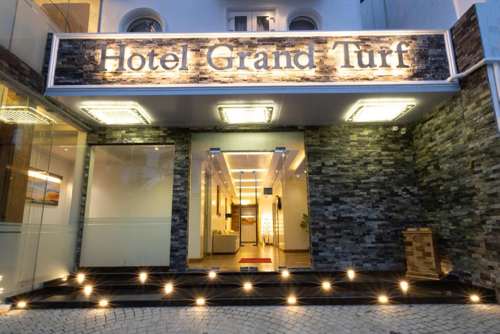 a hotel grand turf with lights in front of it at Hotel Grand Turf in Nuwara Eliya
