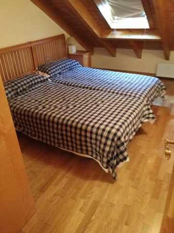 Postel nebo postele na pokoji v ubytování Ático Elurra FORMIGAL