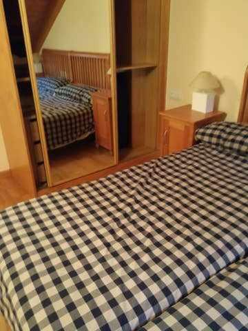 Postel nebo postele na pokoji v ubytování Ático Elurra FORMIGAL