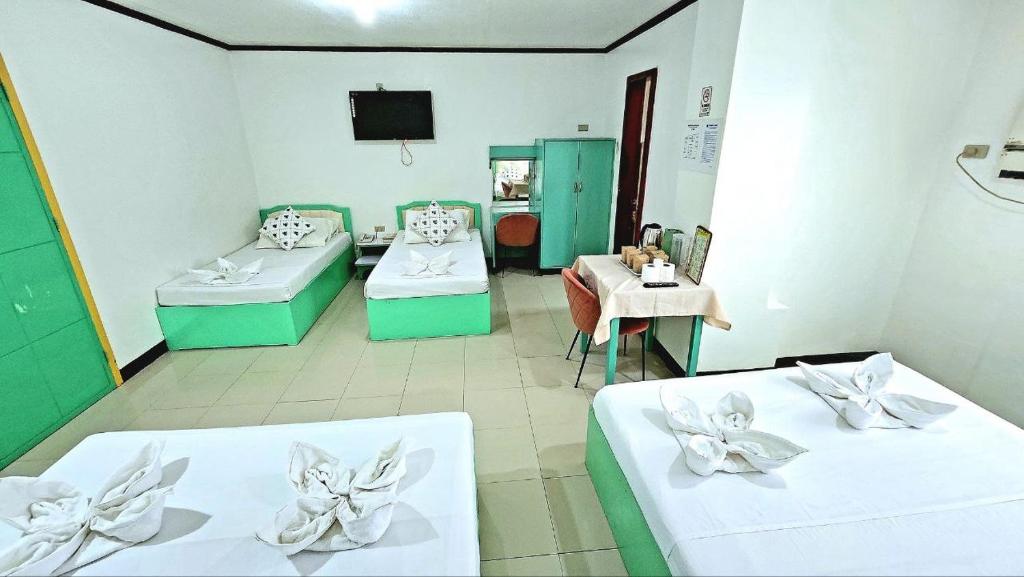 Postel nebo postele na pokoji v ubytování Demiren Hotel