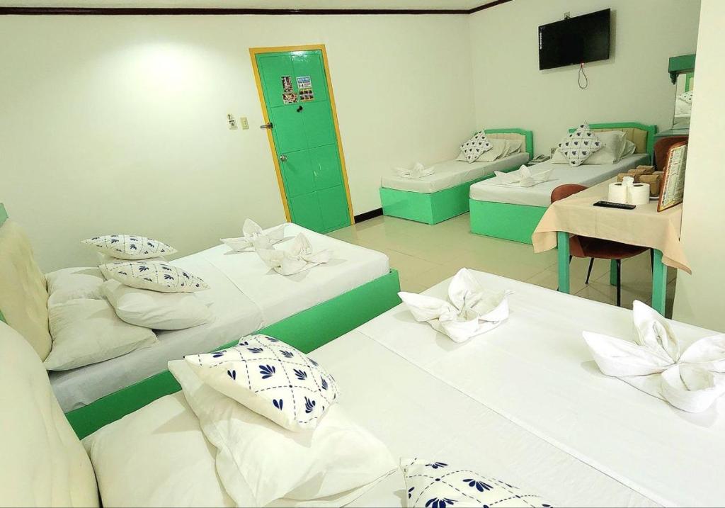Postel nebo postele na pokoji v ubytování Demiren Hotel
