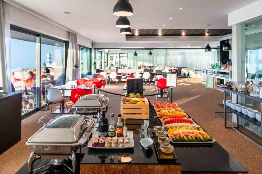 a buffet of food on a table in a room at Pestana Cidadela Cascais - Pousada & Art District in Cascais