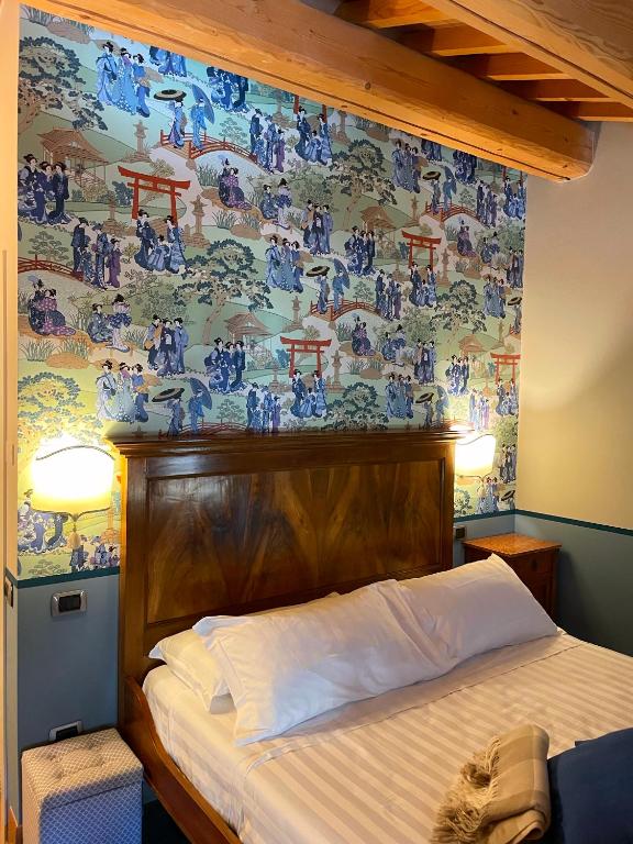 Postel nebo postele na pokoji v ubytování Locanda Lo Scudo