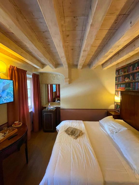 Postel nebo postele na pokoji v ubytování Locanda Lo Scudo