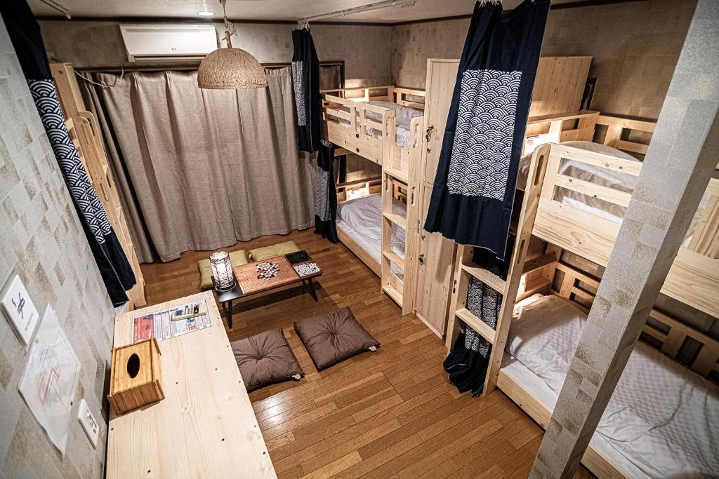 Postel nebo postele na pokoji v ubytování Hisaya Shirakawa 久宿 白川