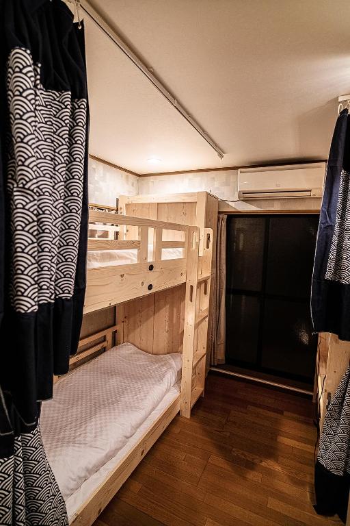 Postel nebo postele na pokoji v ubytování Hisaya Shirakawa 久宿 白川