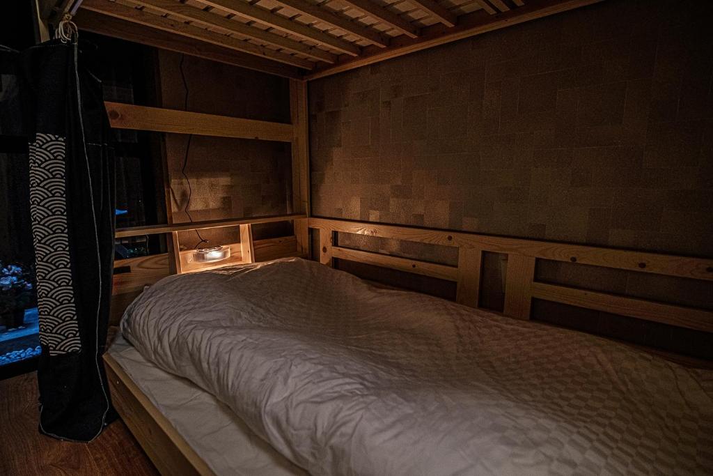Postel nebo postele na pokoji v ubytování Hisaya Shirakawa 久宿 白川