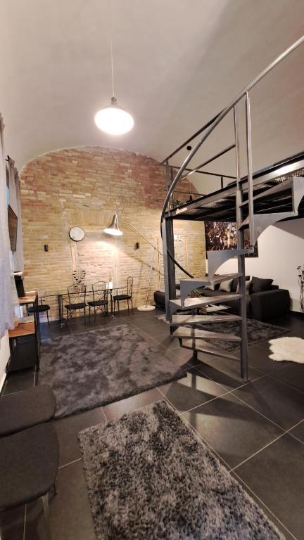 a living room with a loft bed and a table at Kiraly street , Stylish Apartment in Budapest