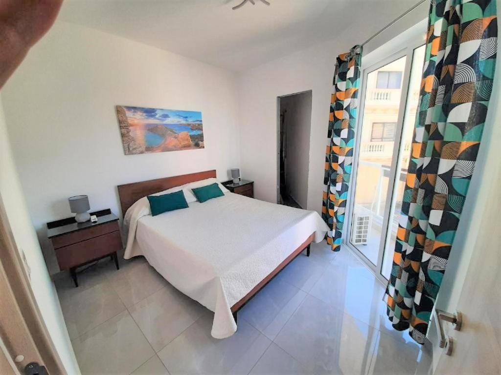 Postel nebo postele na pokoji v ubytování 161 Marinello Apartment