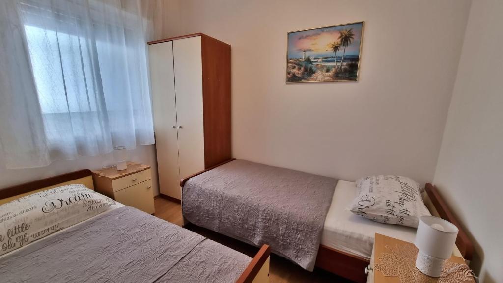 Posteľ alebo postele v izbe v ubytovaní Apartments Slado