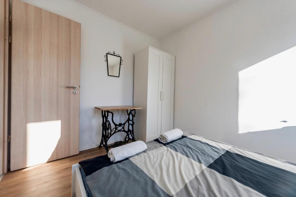 Posteľ alebo postele v izbe v ubytovaní Pitypang Apartman Kápolnásnyék