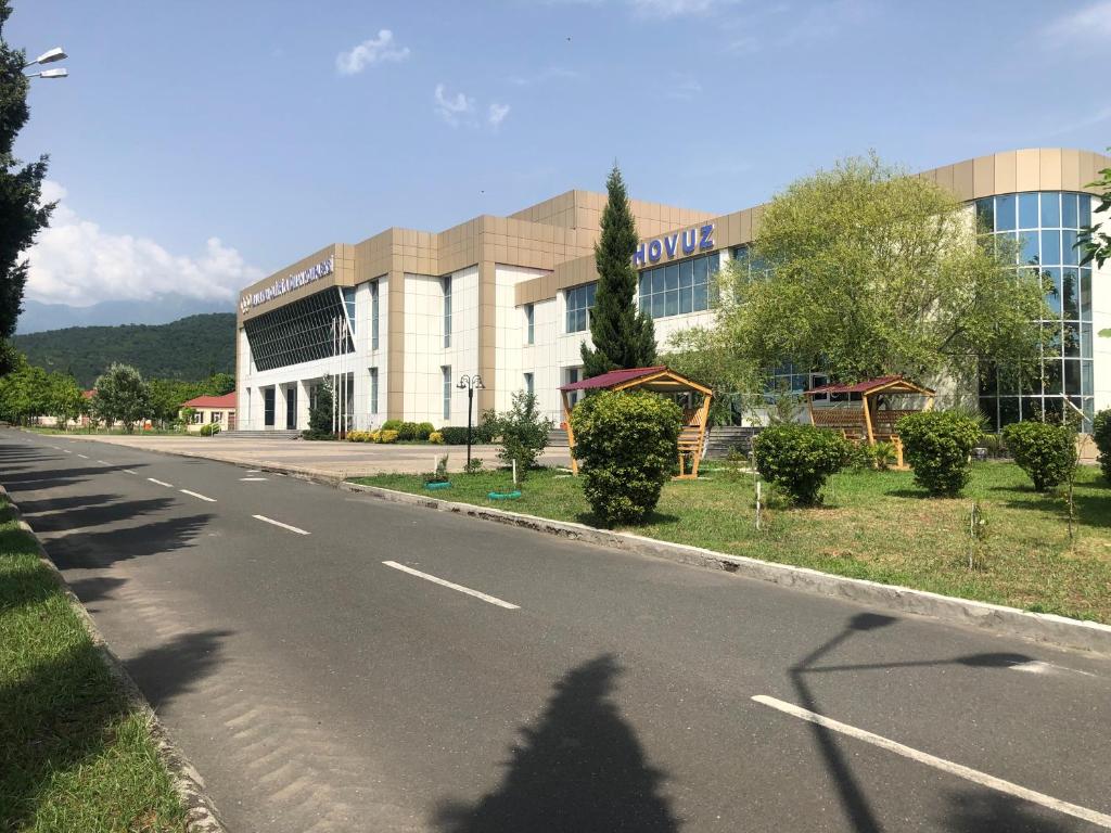 an empty street in front of a building at Arena Hotel Balakan in Balakǝn