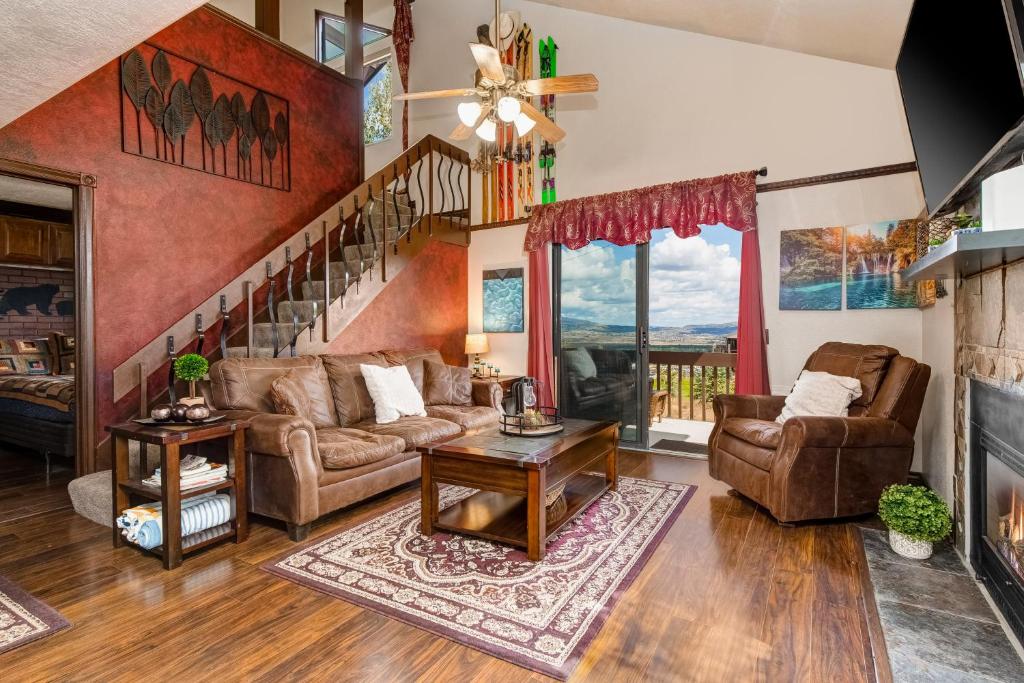 a living room with a couch and a staircase at Red Pine Q8 in Park City