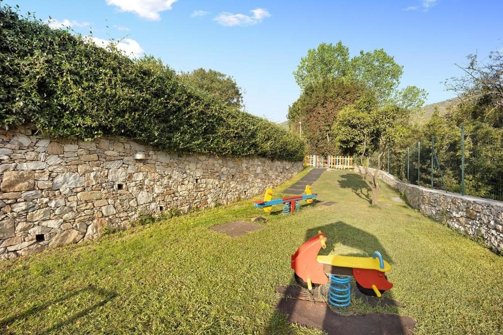 Vonkajšia záhrada v ubytovaní Bungalow Ulivi 148