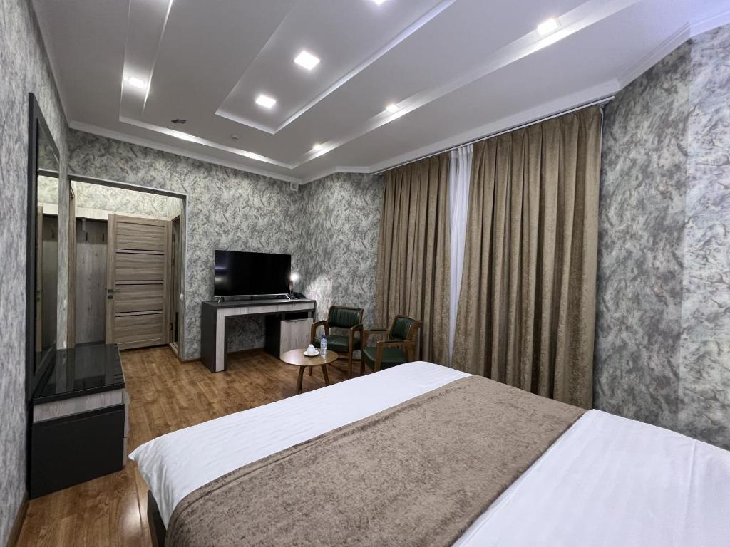 Postel nebo postele na pokoji v ubytování Ada Hotel