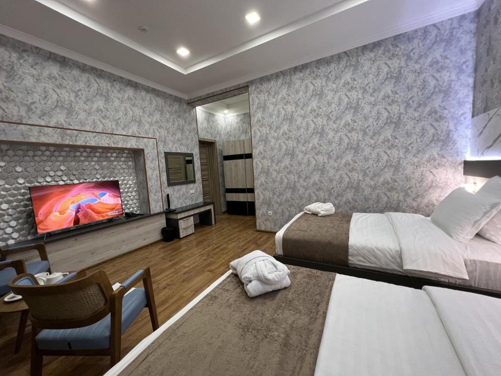 Postel nebo postele na pokoji v ubytování Ada Hotel