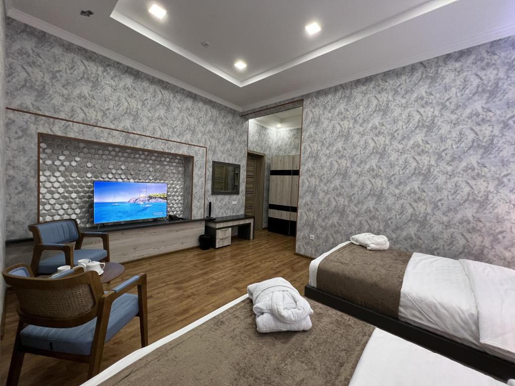 Postel nebo postele na pokoji v ubytování Ada Hotel