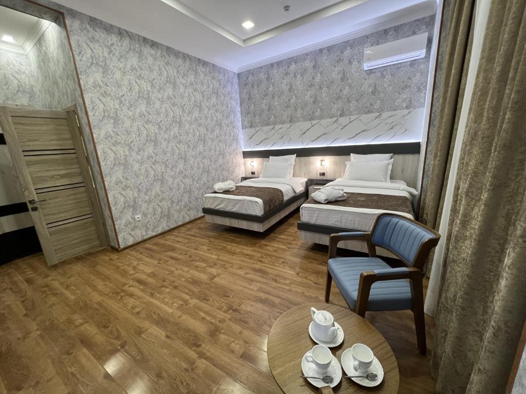 Postel nebo postele na pokoji v ubytování Ada Hotel